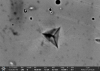 SEM BSE image in channelling contrast of 310 steel after nanoindentation showing the slip traces